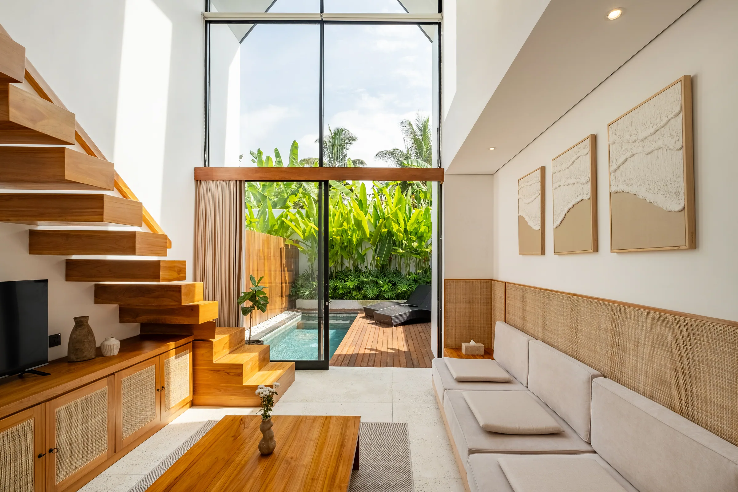 Mezzanine villa A-frame glass facade viewed from the private pool deck